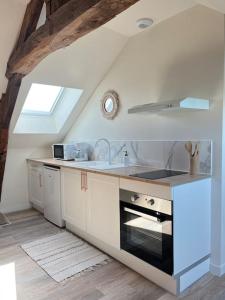 a kitchen with a sink and a stove at *CASA Mendoza* in Cholet +11 photos
