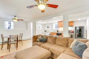 a living room with a couch and a table at Milford Vacation Rental about 1 Block to Beach! in Milford
