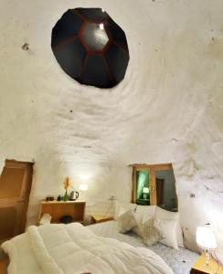 a bedroom with a soccer ball on the wall at Spiti Eco Domes in Kaza
