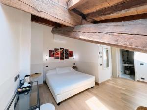 Postel nebo postele na pokoji v ubytování Rechigi Park Hotel