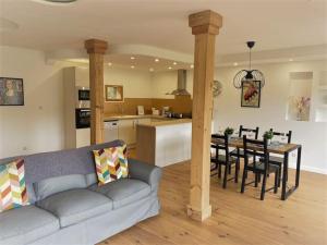 a living room with a couch and a table in a kitchen at 3 PRIVATE POOL with Stunning Views!! in Plazac