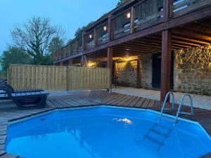 a swimming pool in front of a house at 3 PRIVATE POOL with Stunning Views!! in Plazac