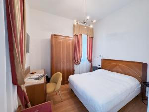 Postel nebo postele na pokoji v ubytování Rechigi Park Hotel