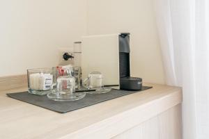 a coffee machine sitting on top of a counter at Poseidon Rooms in Cagliari