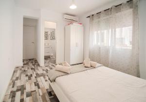 Postel nebo postele na pokoji v ubytování Aroma D’Valencia Apartment