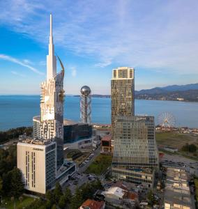 an aerial view of a city with tall buildings at Coastal Oasis - Sea View Porta Batumi 2 bedroom apartment in Batumi
