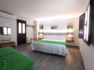 Кровать или кровати в номере Casa Hotel LA JARANA