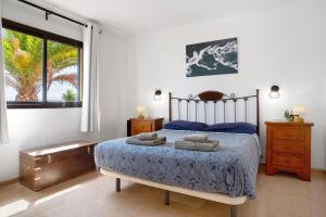 Posteľ alebo postele v izbe v ubytovaní Oasis Tamarindo