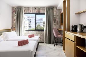 Łóżko lub łóżka w pokoju w obiekcie Stic Urban Hotel & SPA