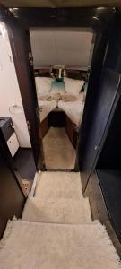 an overhead view of a small room with two beds at BATEAU à Quai in Avignon