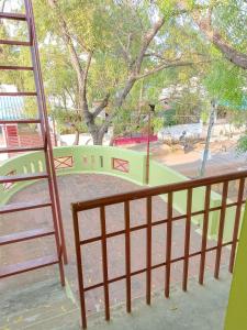 a stairway leading to a park with a playground at Maria Vilas in Tirunelveli