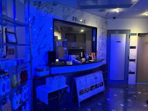a store with a blue light in a room at Hotel Grand Garden (Adult Only) in Yokohama