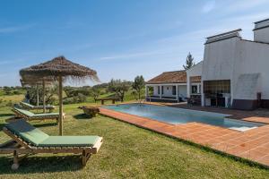 an image of a house with a swimming pool at Alandroal Nature & Pool Retreat- Courela dos Tojos in Alandroal +25 photos