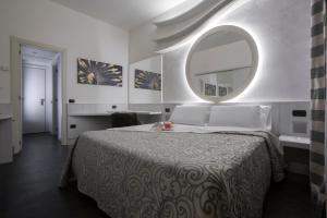Postel nebo postele na pokoji v ubytování Hotel City Legnano