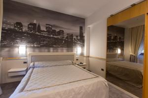 Postel nebo postele na pokoji v ubytování Hotel City Legnano