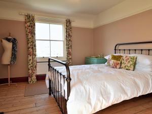 a bedroom with a bed and a window at 5 bed property in Hastings Sussex 57217 in Hollington