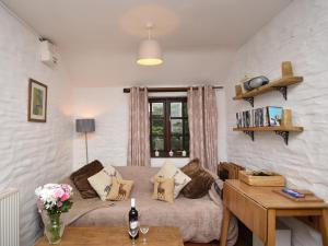 a living room with a couch and a window at 2 Bed in Cilgerran FB173 in Cilgerran