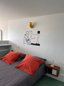 Postel nebo postele na pokoji v ubytování Le Corbusier Expérience