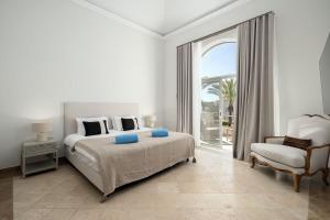 Giường trong phòng chung tại Villa Flamingo - Quinta do Mar