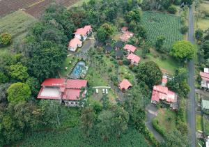 an aerial view of a house with a yard at Hotel Eco Arenal in Fortuna