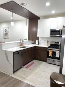 a kitchen with a sink and a stove at 45 William st Newark NJ in Newark