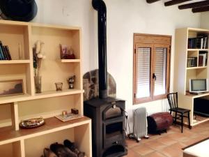 a living room with a wood stove in a room at Charming Apartment in Tolva, 50 m², with Terrace in Tolva