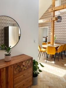 a dining room with a table and a mirror at Štupartská 9 - Old Town Residence in Prague