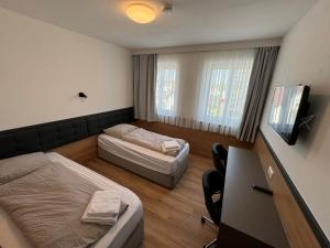 A bed or beds in a room at F Hotel 24h Check-In