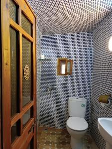 a bathroom with a toilet and a sink at Dar Mchachti fes in Fez