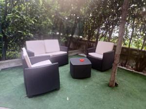 a group of chairs and a table on a patio at DAM Home in Modena