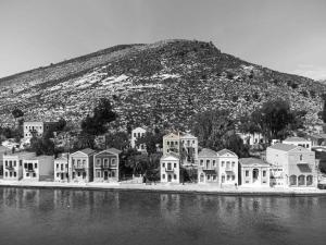 a group of houses in front of a mountain at Marilena in Meyisti
