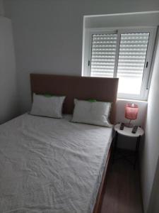 Posteľ alebo postele v izbe v ubytovaní Casa Paulinho