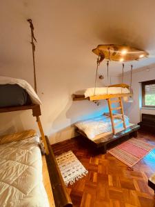 a bedroom with two bunk beds in a room at Lisbon Soul Surf Camp in Cascais