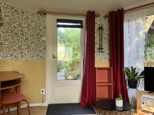 Photo de la galerie de l'établissement B en B Op Steendam, Tuinkamer onder de appelboom, à Steendam