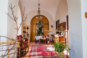 a hallway with a table and a dining room at YourHome - Casa Cafiero in Meta