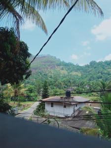 a house with a view of a mountain at WATHSALA HOME VILLA(homestay) in Ella