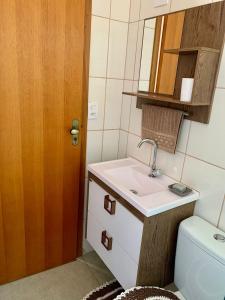 a small bathroom with a sink and a toilet at QUARTO UNIFESP Prox RODOVIAS, MARGINAS, ALPHAVILLE in Osasco