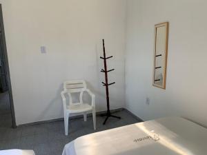 Una cama o camas en una habitación de Recanto do Porto _ Hospedagem