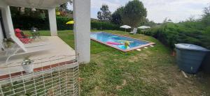 a swimming pool in the backyard of a house at T2 avec Piscine exclusive in Bourg-Saint-Bernard +5 photos