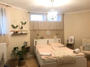 Posteľ alebo postele v izbe v ubytovaní BellaVista 1 Apartman