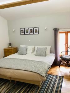 A bed or beds in a room at Aude Escape