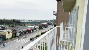a balcony with a view of a city street at Farmont Seafront Acquamarine Suite by CaSa Check in Chioggia