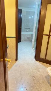 a bathroom with a shower and a toilet and a tub at The Hotel and Apartment At Berjaya Times Square in Kuala Lumpur