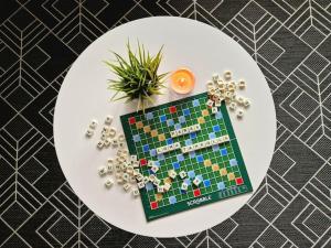 a white plate with a board game on a table at Apartment Kehtola, Tahkovuori in Kuopio