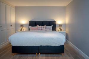 Кровать или кровати в номере Uhlenhorst