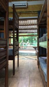 a room with two bunk beds and a window at Sitio Simple Life in Ubatuba
