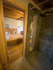 a view of a bedroom from the door of a room at Chalet Valchiavenna in San Cassiano