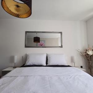 Postel nebo postele na pokoji v ubytování Apartman West Side