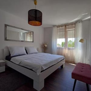 Postel nebo postele na pokoji v ubytování Apartman West Side
