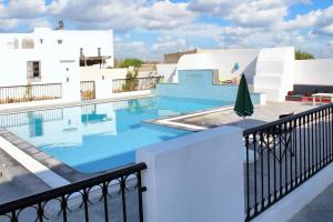 a pool on the roof of a building at Spacious villa with private pool in Djerba in Houmt Souk